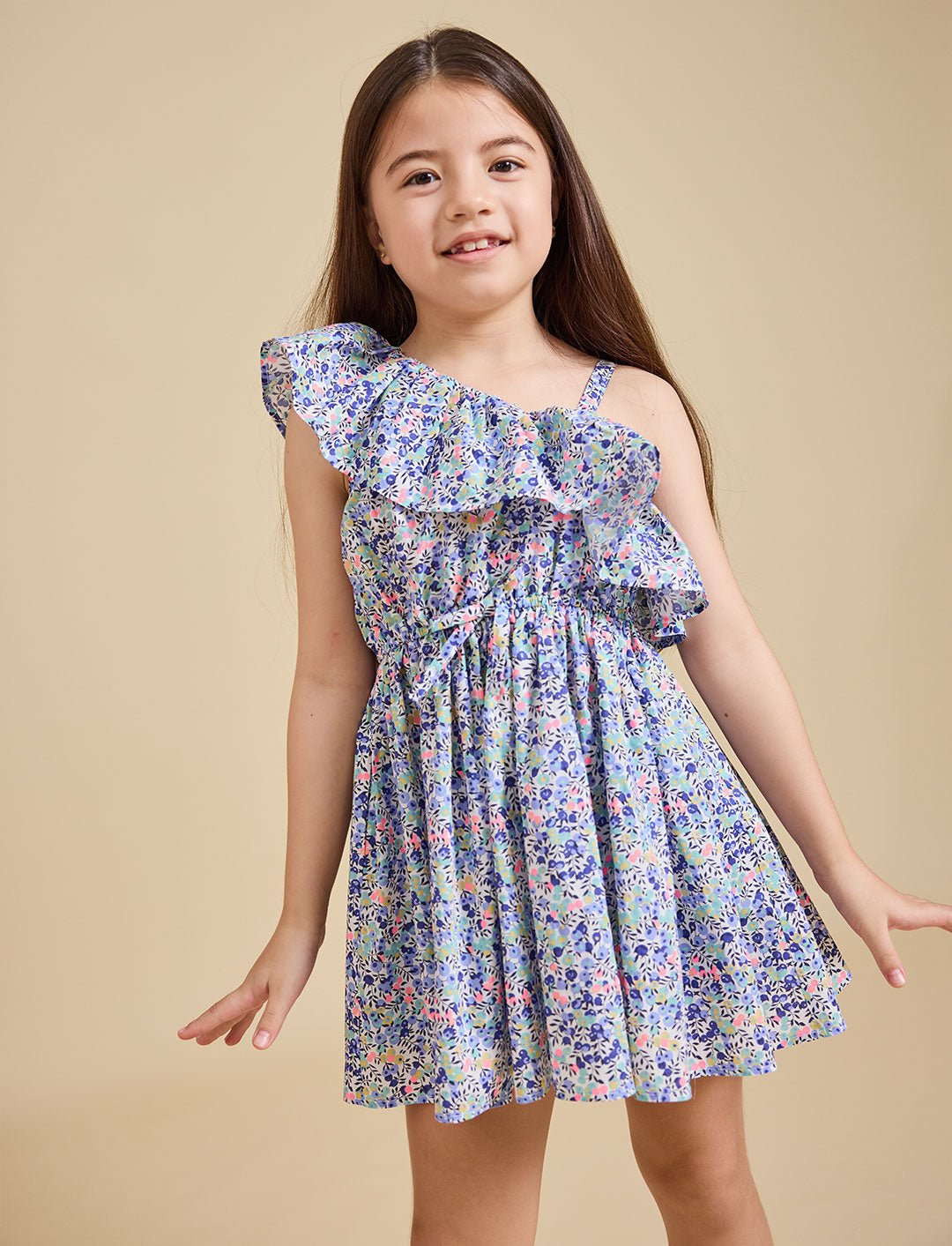 Close up of the Daisy dress in Liberty fabric on a beige background - Ce Jour-La