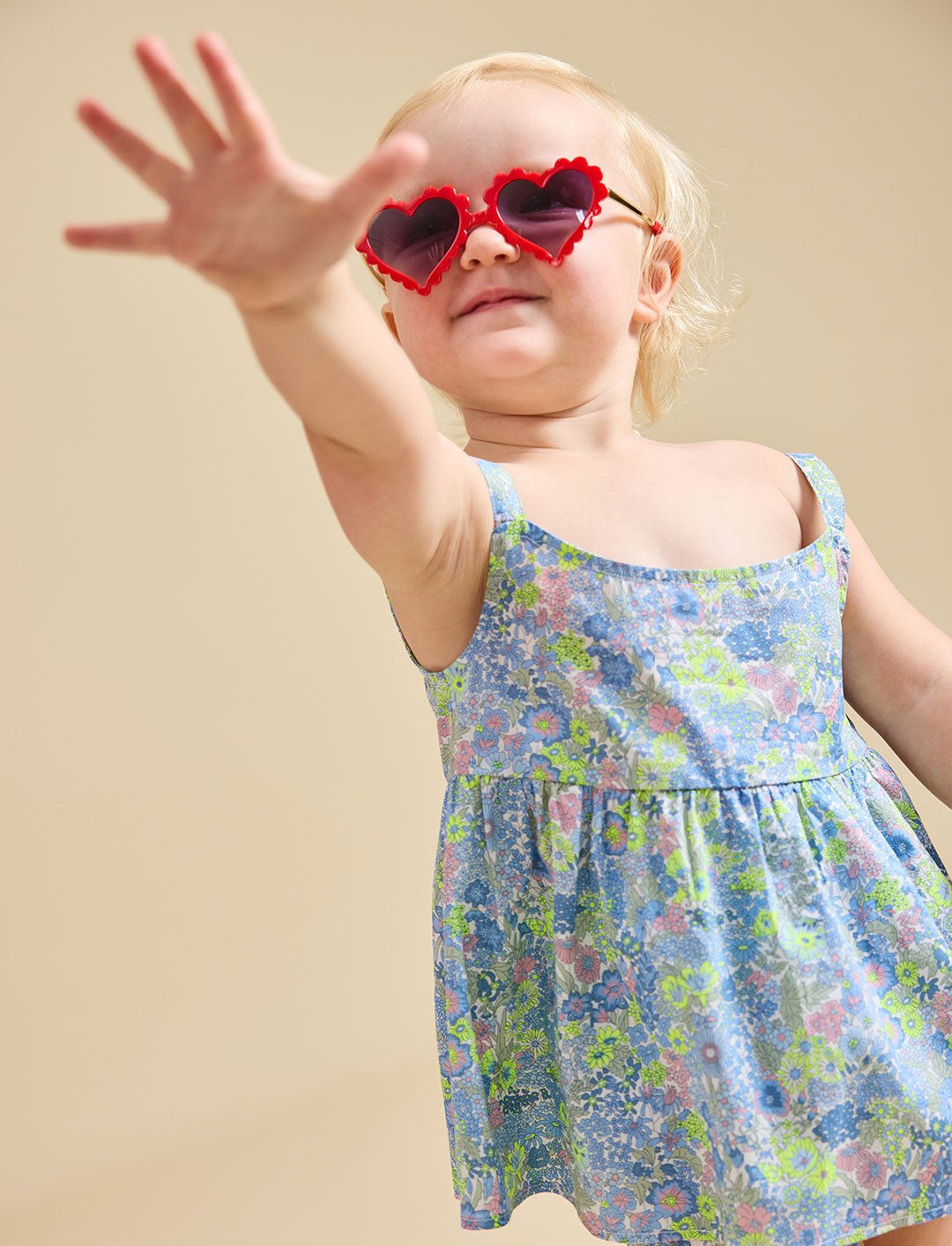 Close up of a girl wearing heart sunglasses modelling the delilah liberty print set - ce-jour la
