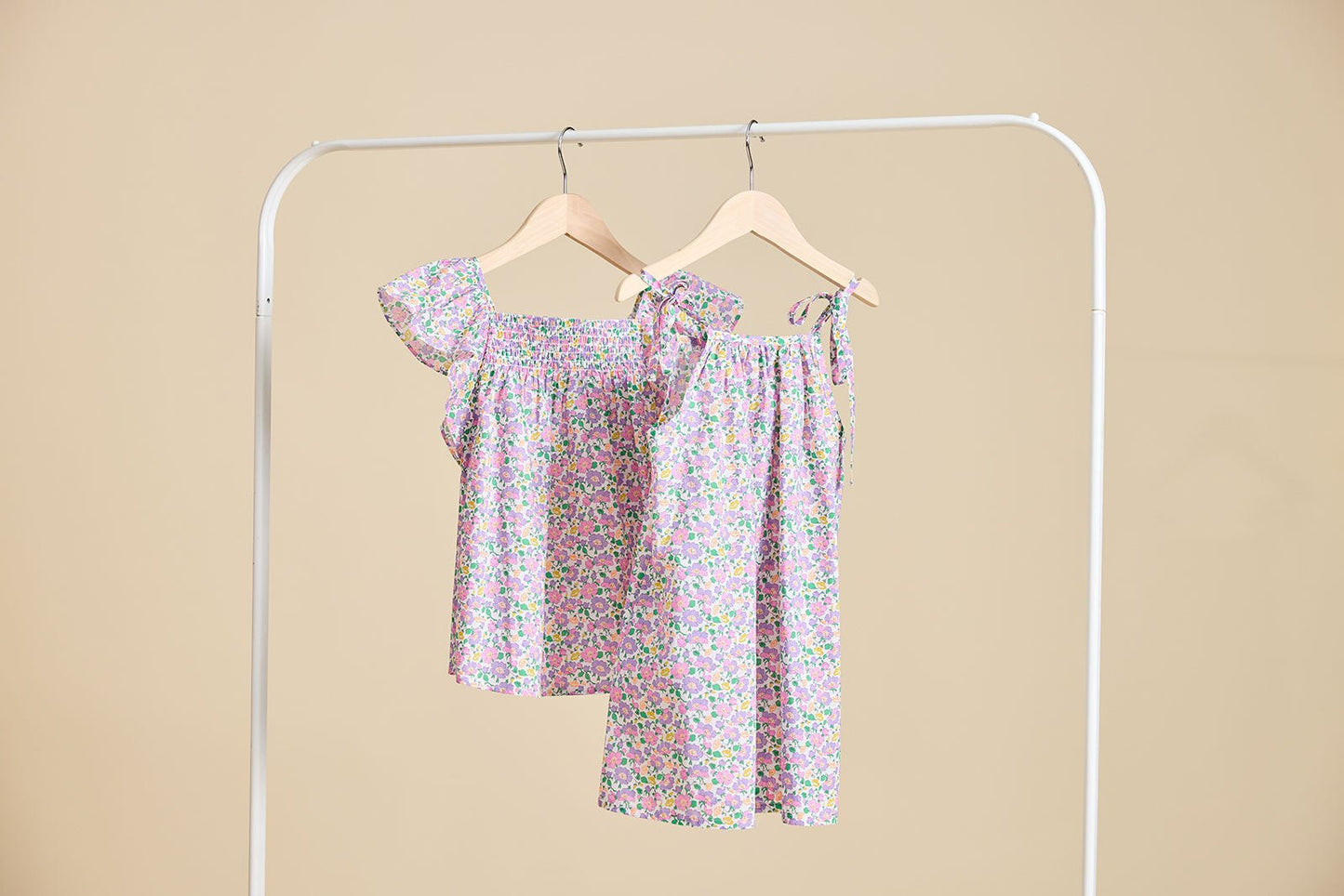 The fleur dress and top hanging from a clothes rail