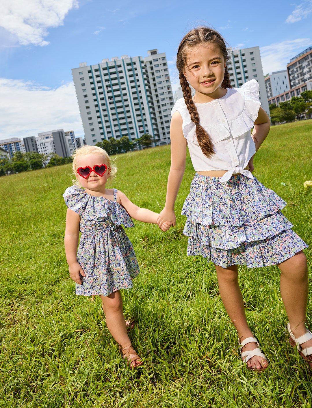 Two girls in a field modelling the odette liberty print range - ce-jour la