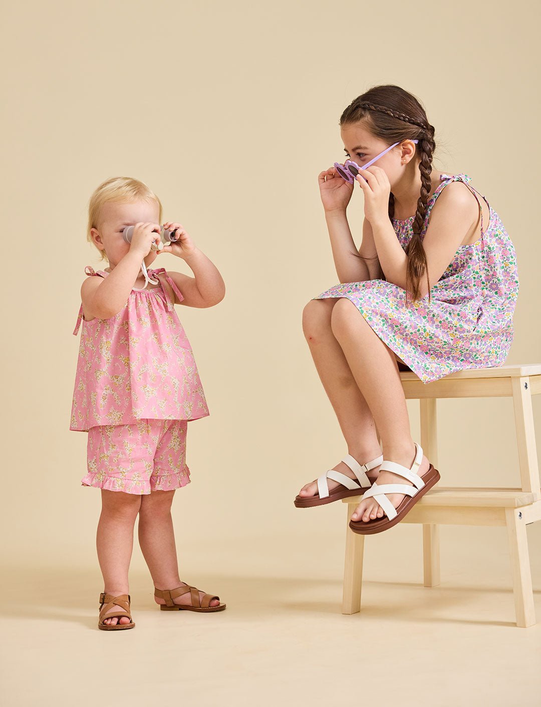Young girl modelling the Rosalie pink set in liberty fabric