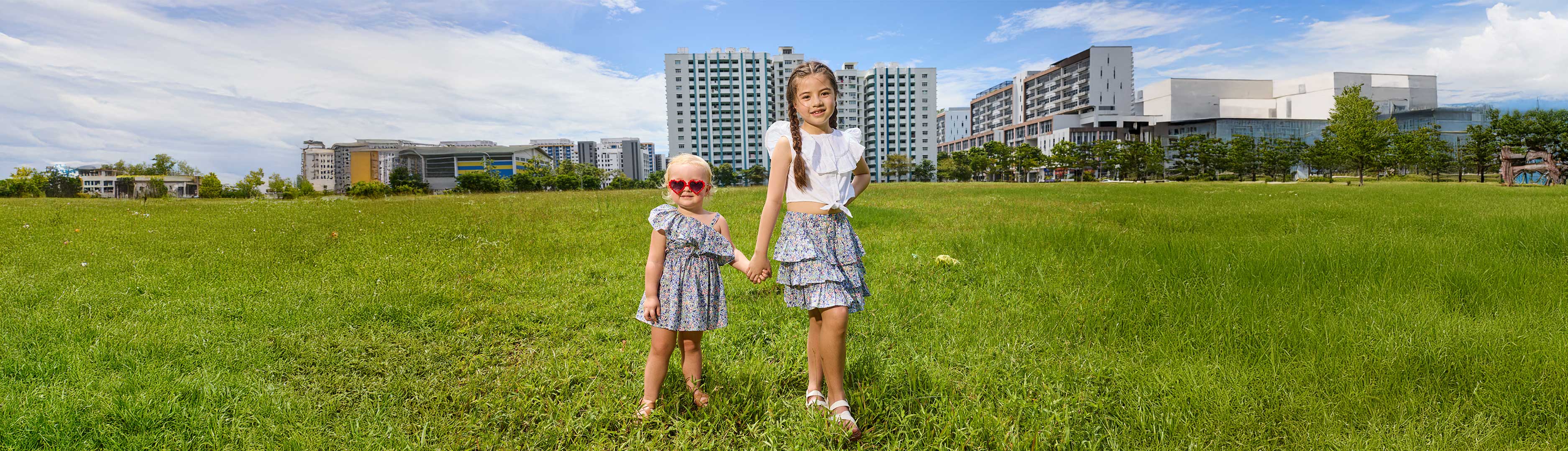 Two girls modelling liberty print clothing from ce-jour la