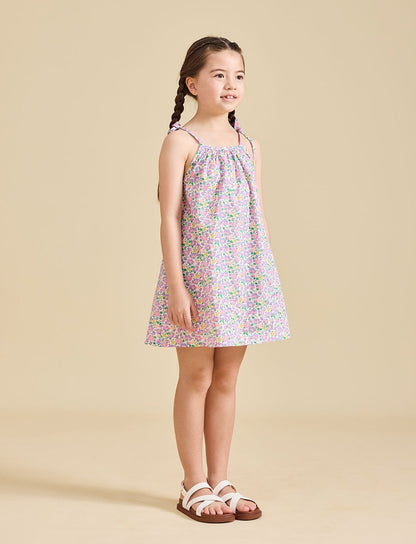 Girl wearing Fleur dress in Liberty fabric for girls age 2-8