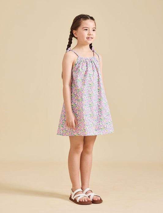 Girl wearing Fleur dress in Liberty fabric for girls age 2-8