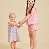 Young girl holding hands wearing the Fleur Liberty Print dress from ce-jour la