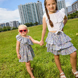 Two girls in a field modelling the odette liberty print range - ce-jour la