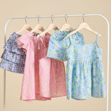 A selection of liberty print dresses on a clothes rail from ce-jour la