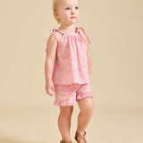 Girl modelling the pink Rosalie set in Liberty fabric and brown sandals - ce-jour la