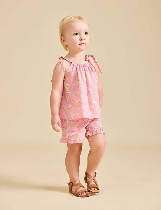 Girl modelling the pink Rosalie set in Liberty fabric and brown sandals - ce-jour la