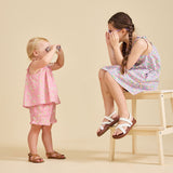 Girl wearing the Rosalie Set in pink Liberty fabric for girls aged 2-8 - Ce Jour-La