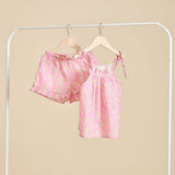 The Rosalie set in Pink hanging from a clothing rail