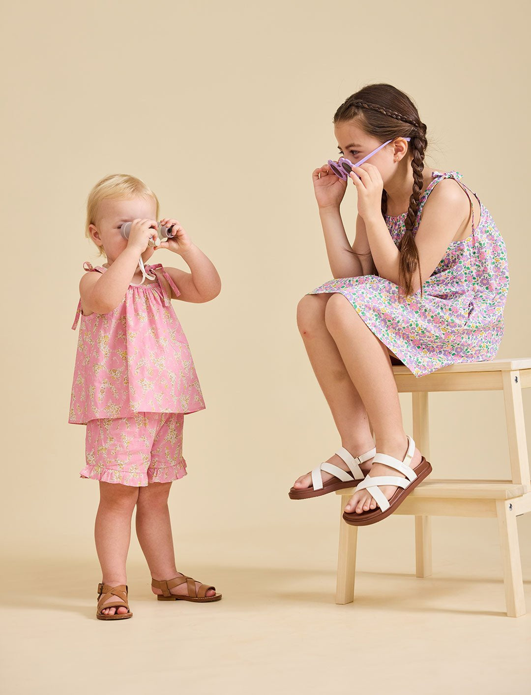 Young girl modelling the Rosalie pink set in liberty fabric