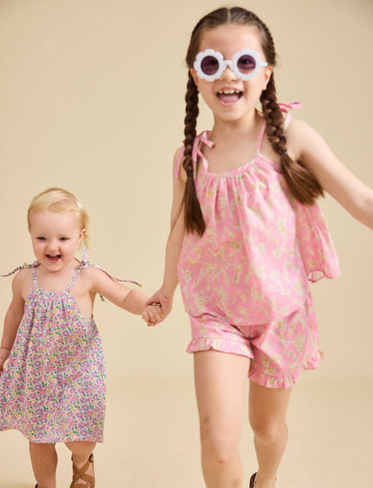 Girl modelling the Rosalie Set in pink Liberty fabric for girls aged 2-8 - Ce Jour-La